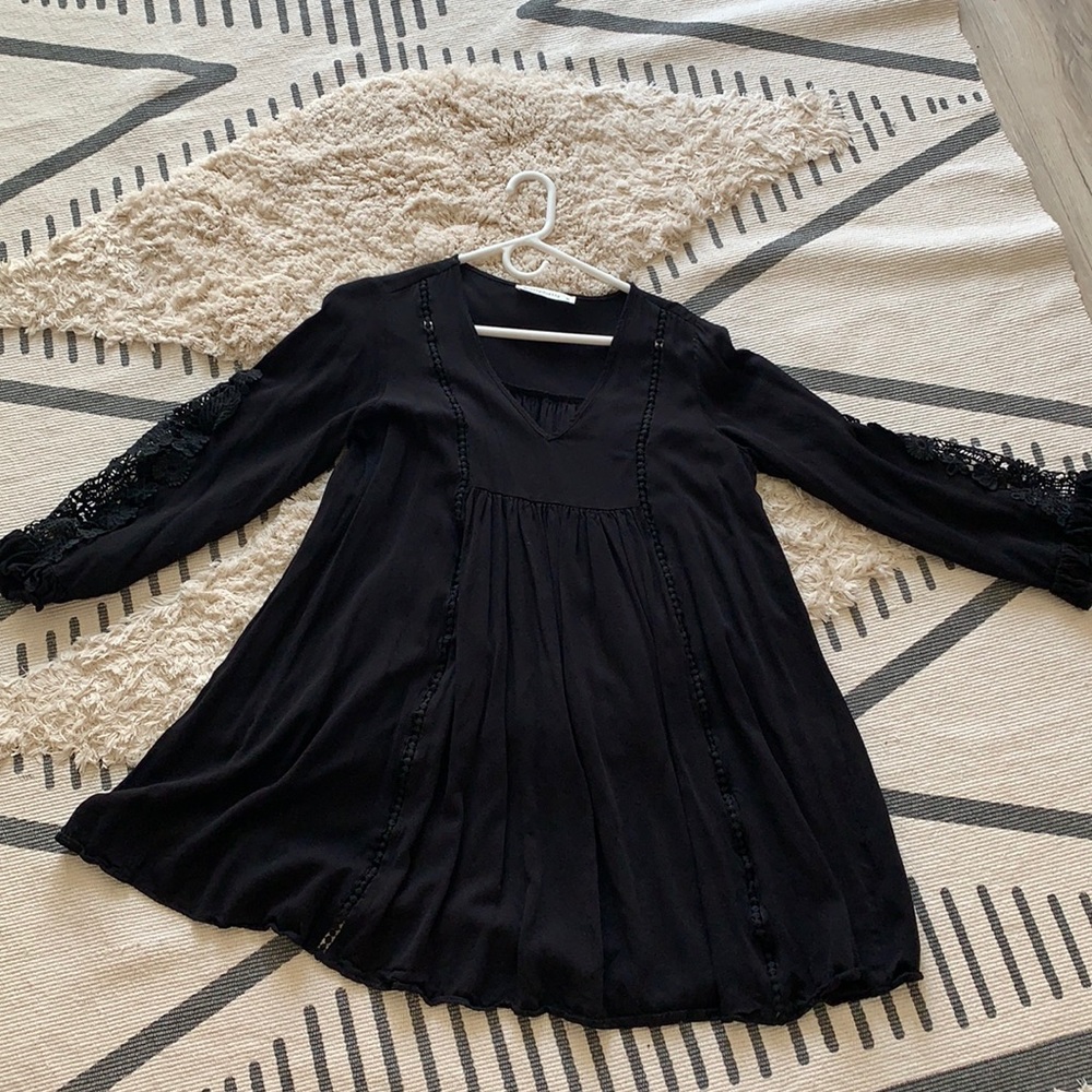 Women’s black smock dress with lace on the sleeves
